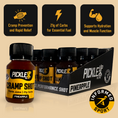 Load image into Gallery viewer, PickleUp Pro Cramp Shot Pineapple flavor e-liquid bottles shown in a retail display box with a single bottle in front. The bottles are amber glass with black caps, and the labels are yellow and black.
